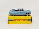 a blue toy car sitting on top of a yellow box