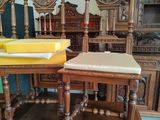four chairs and a table with a yellow tray on top of it