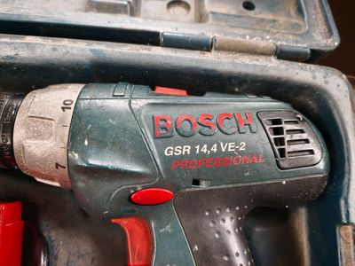 a cordless drill that is sitting in a tool box