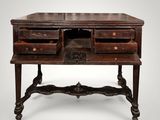an old wooden desk with drawers on top of it