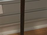 an image of a wooden table with a vase on it