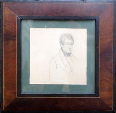 tableau représentant un homme en costume-cravate, dans un cadre en bois