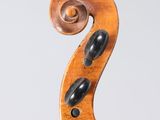 an old violin with a wooden back and a wooden bow