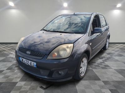 a picture of a blue ford fiesta parked on a checkered floor