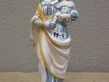 a figurine of a woman holding a child