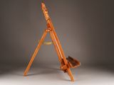 a wooden easel with a piece of wood on it