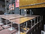 many tables that are set up in a large room