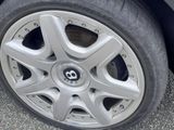 a close up of a tire on a car ' s rim