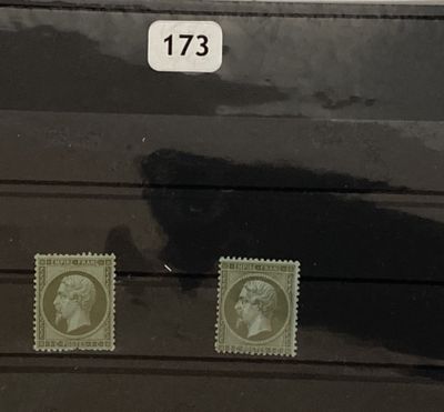 two stamps on the back of a black suitcase