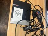a table with a laptop and a bunch of wires