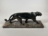 statue of a black panther on a marble base