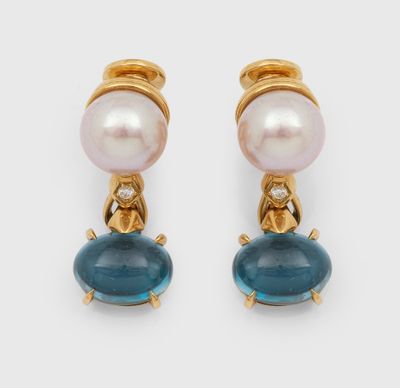 a pair of pearl and blue glass earrings