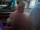a pink dress on a mannequin in a shop