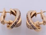 a pair of gold earrings with diamonds on a white background