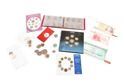 a lot of different coins and cards on the table
