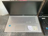 two laptops sitting next to each other on a table