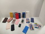 many cell phones that are sitting on a white table