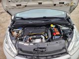 a car that has its hood open with the engine in it