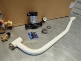 a white hose and a valve on a table