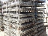 a large pile of cages that are stacked on top of each other