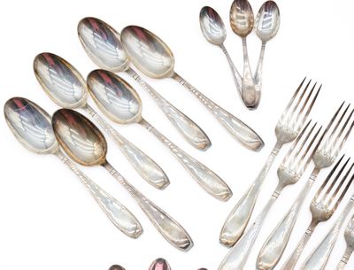 a lot of silver spoons and forks on the table