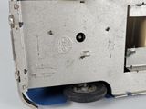 a close up view of a metal device with a blue handle