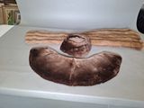 someone is making a fake mustache out of fur on a table