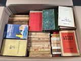 a box full of books that are sitting on a table