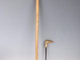 an image of a wooden stick and a wooden stick on a white surface