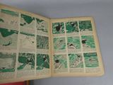 an open book with a picture of a baseball game in it