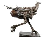 sculpture of a horse made of metal on a wooden base