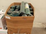 a cardboard box full of garbage sitting on the floor