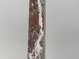 marble obelisk on marble base with a black base