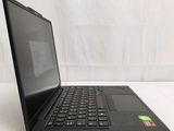 a black laptop computer sitting on a white surface