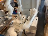 a robot that is sitting on a table in a warehouse