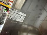 a picture of a stainless steel tank with a label on it