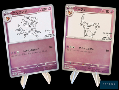 deux cartes Pokémon sur lesquelles figure l'image d'un personnage de dessin animé