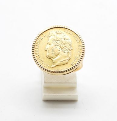 an image of a gold coin sitting on top of a white stand