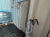 the inside of a shipping container with a machine in it