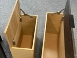 two open wooden boxes on the floor next to each other