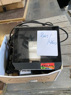 a box that has a computer in it on the ground