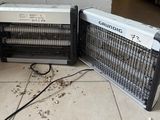 two electric heaters sitting on the floor next to each other