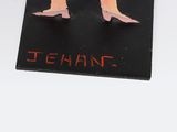 a picture of a pair of shoes on top of a sign