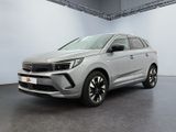 a silver suv is parked in a large room