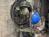 a machine that is sitting in a building with a blue helmet on it