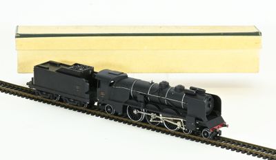 a toy train that is sitting on the tracks next to a box