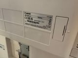 a close up of a white machine with a label on it