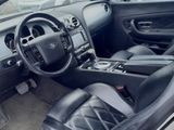 the interior of a car with black leather seats and a steering wheel