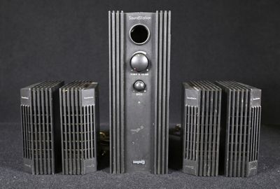 four speakers that are sitting on a table