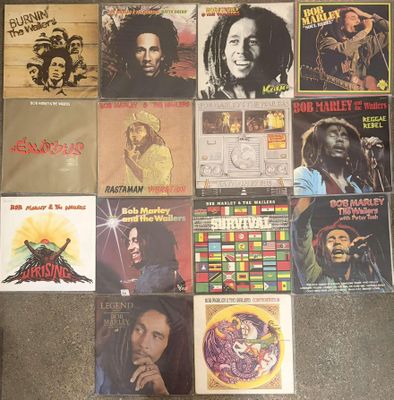 various bob marley records on display on the floor